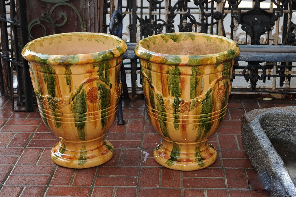 A PAIR OF ANDUZE LARGE TERRACOTTA HAND GLAZED POTS .HAND MADE IN EUROPE.