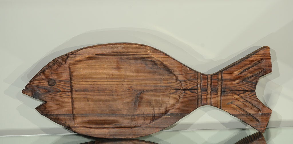 In the manner of Witco- driftwood fish. Wall mount wire attached to back.