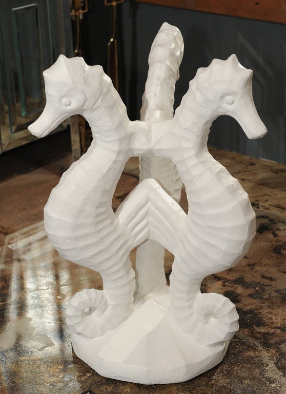 Matte white case cement painted seahorse table base. Currently with new 32