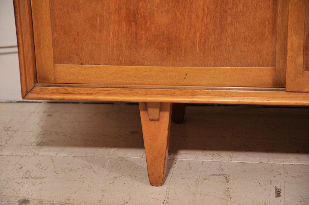 Edward Wormley sideboard, mfg. Dunbar-1950's. Sliding doors and drawers with brass hardware.