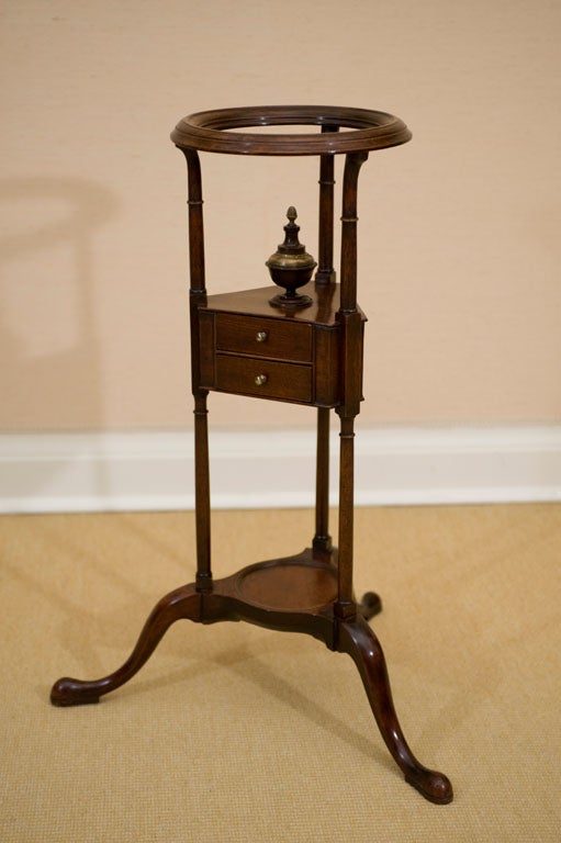18th century Georgian period Wig Stand in patinated mahogany, fitted with two shaped drawers and raised on cabriole legs.