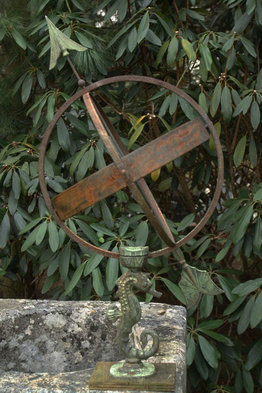 A bronze, copper and iron armillary sphere, the support a finely modeled seahorse with verdigris patina, marked 
