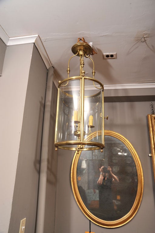 Georgian brass circular lantern with three lights.