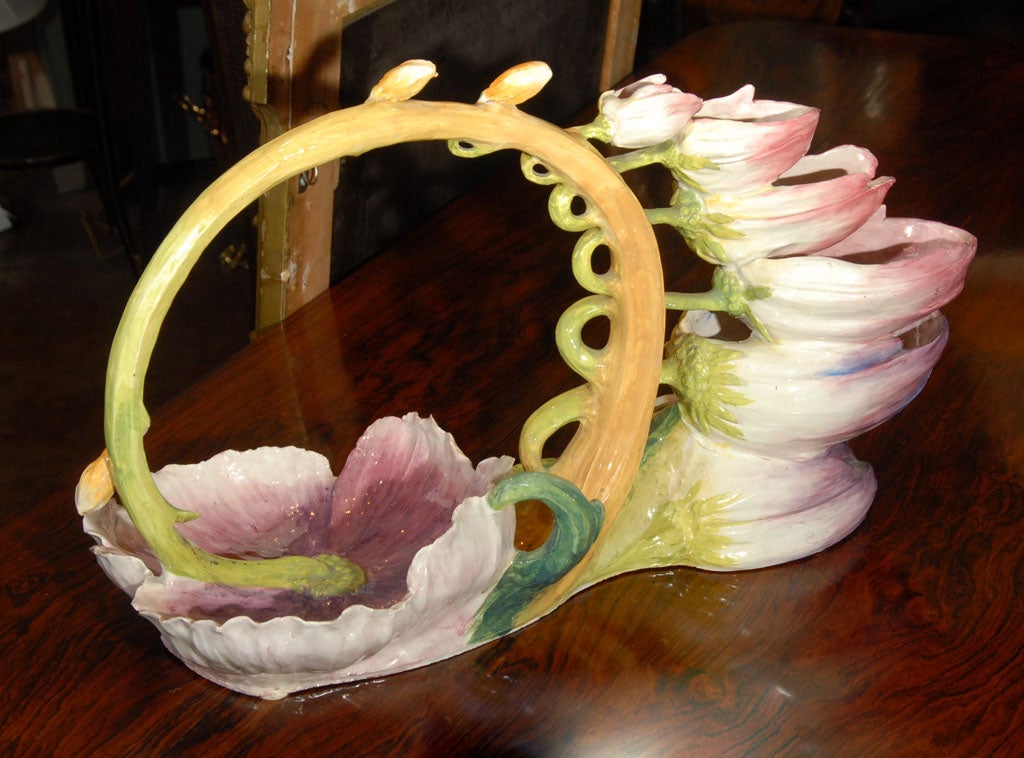 An Italian art pottery centerpiece in the Art Nouveau manner, featuring a graceful design of flower blossoms with a hand-painted Majolica glaze.

Perfect for a garden room or conservatory!