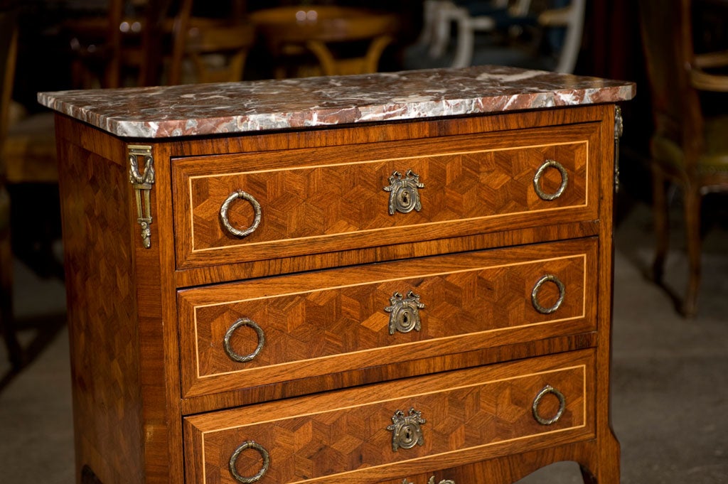 Small scale Louis XVI style 3 drawer commode with mahogany cube marquetry and satinwood stringing, all original bronze hardware and mounts and original marble.