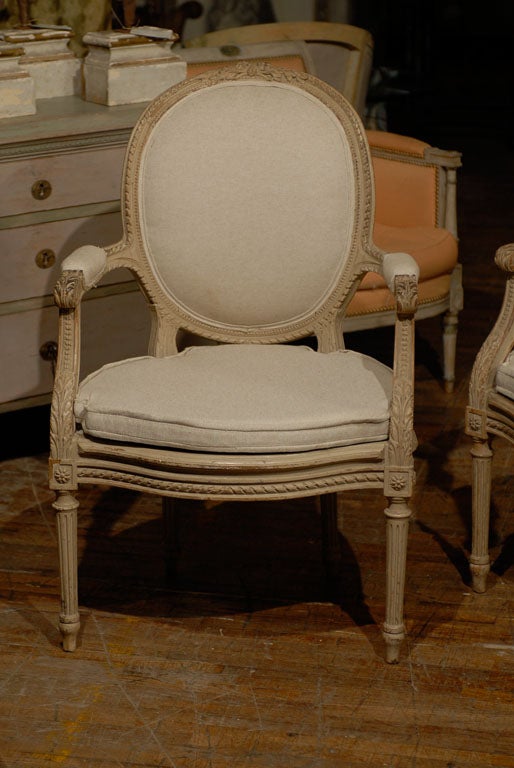 Louis XVI Exquisite Pair of French Oval Back Painted Wood Upholstered Bergeres Chairs
