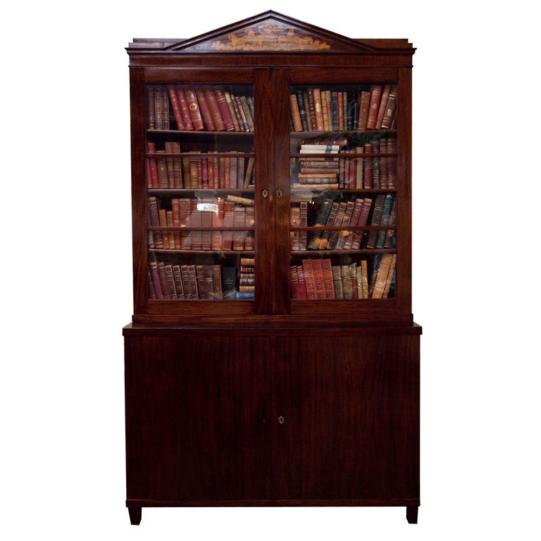 Biedermeier bookcase on top of a two solid doors cabinet