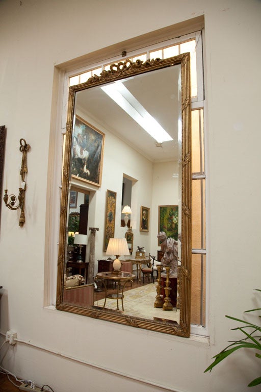 Gilded floor mirror
