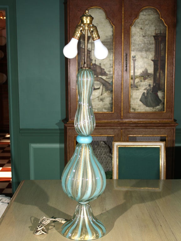 Large spectacular aqua and clear with gold striped Murano glass lamp. Measures: Glass body of the lamp is 28 1/2