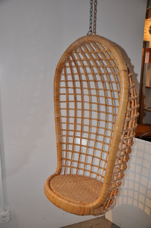 This iconic hanging rattan egg chair is ideal for relaxing or reading and can easiliy accomodate a throw pillow or soft seat cushion. The seat is tilted slightly upward so that you sink back into the chair which creates a craddling affect. Excellent