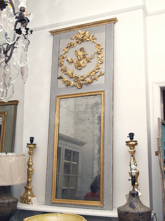 19th century painted and gilded Louis XVI trumeau mirror.