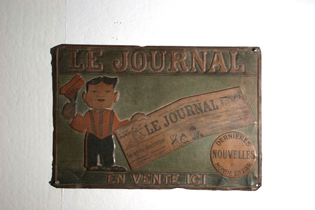 Charming advertisment for a French newspaper, with raised letters and figure of a very short salesman displaying a very large copy of Le Journal, featuring all zee latest news.
