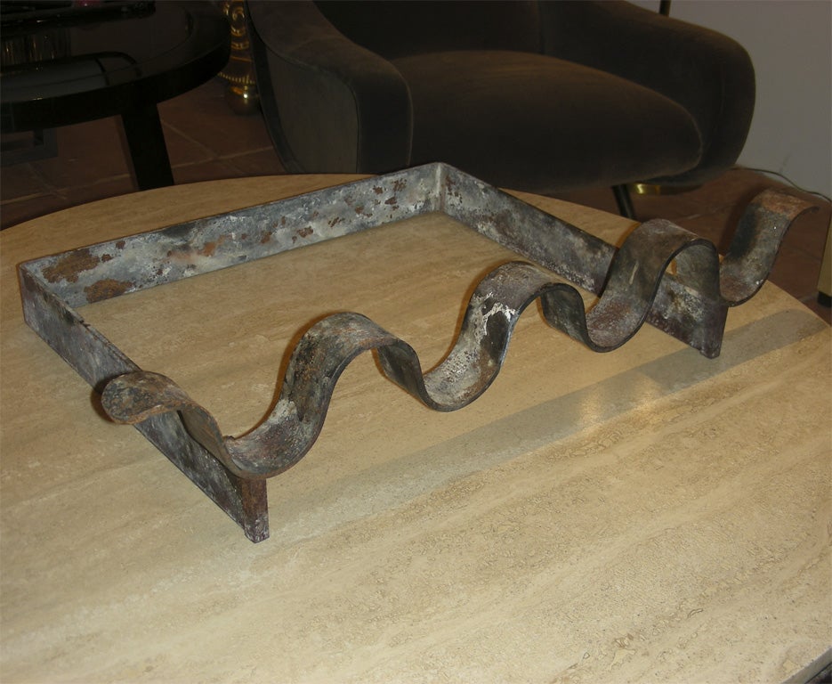 1950s andiron in metal by Jean Royère.