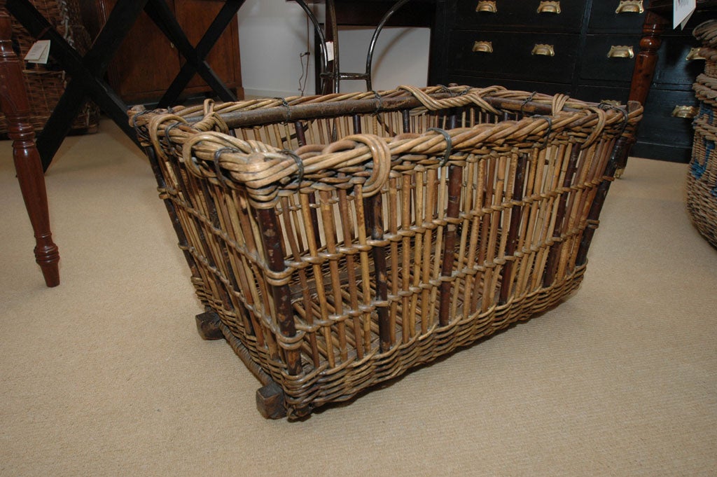 A turn-of-the-century laundry basket solid and strong enough to hold firewood.