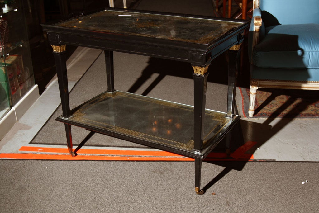 Pair of Jansen Ebonized & Eglomise Glass Tea Carts