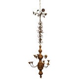 A Twelve Light Wood and Iron Chandelier
