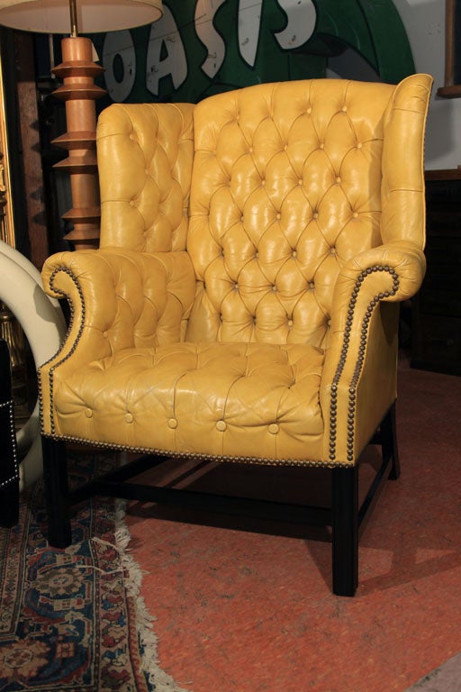 Impeccable Leather Wingback armchair in a very rare bright yellow leather and perfect nailhead trim. This is a superb piece 1970s brilliant-color seating in untouched original condition.