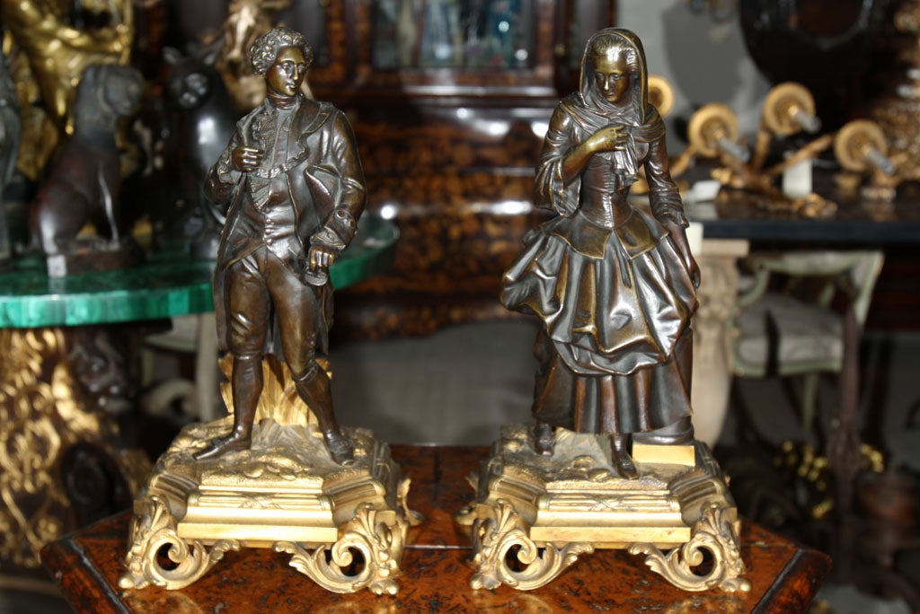 A well cast and  chased pair of figures  on  gilt rococo  bases