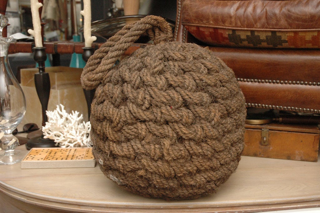 Large rope ball,  woven by sailors,  used to throw from boat to dock or boat to boat for tying up
