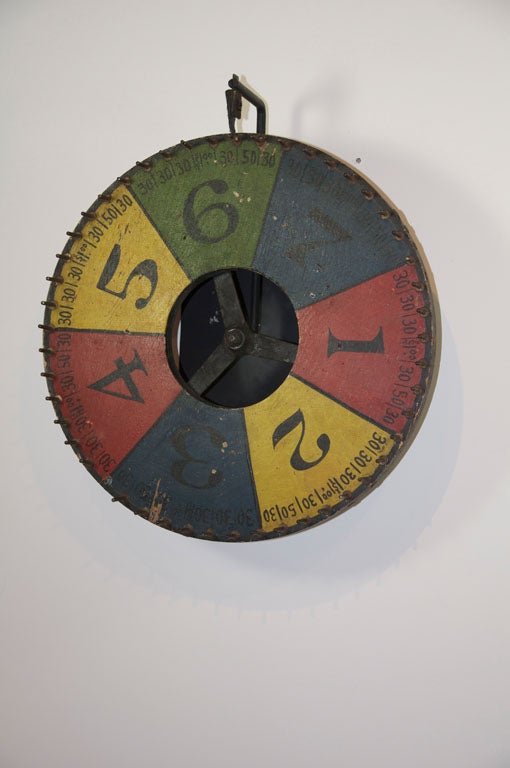 Graphic handpainted carnival gaming wheel.  Excellent paint surface and numbering detail.  Found in the south.