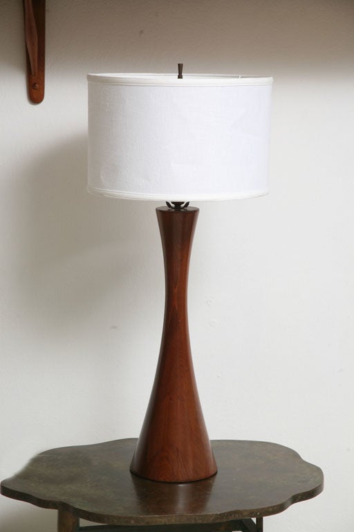 Philip Powell lathe turned table lamp.<br />
Impressive size,original walnut finish