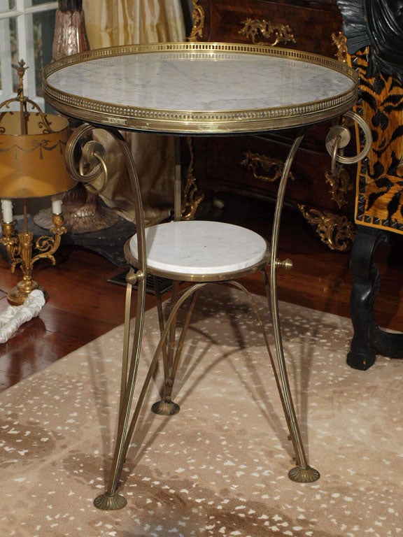 19th c French marble and brass gueridon with galleried top and trifed base.