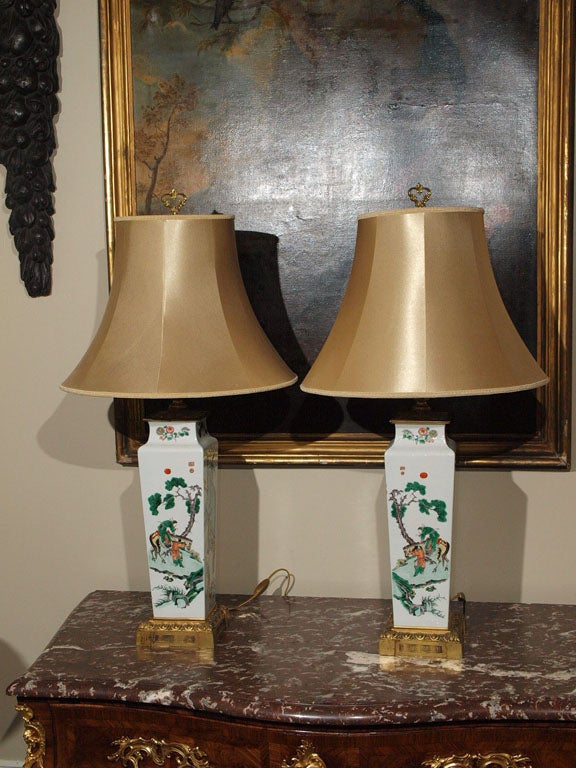 Pair of 18th C Famille Vert chinese lamps with french gilt bronze mounts now as lamps with silk shades
