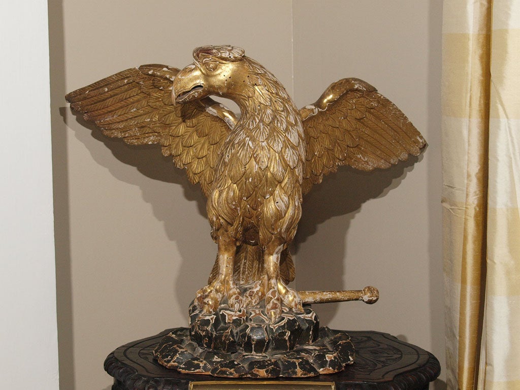 New Hampshire Eagle carved from Tulip Poplar with gilt and paint decoration. This by oral tradition came from a New Hampshire courthouse from the center of the broken pediment in the main court room. We have owned this for 10 years and purchased it