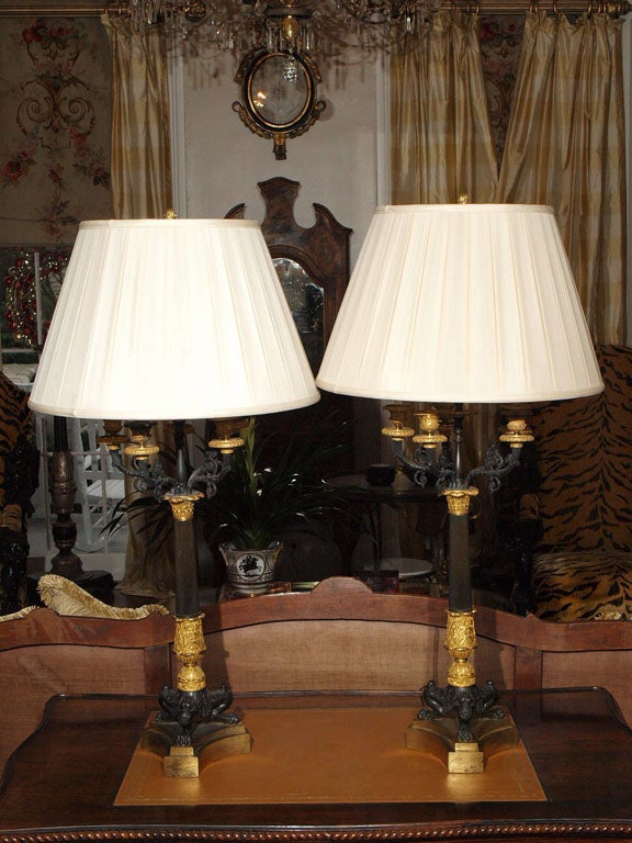 PAIR OF 19TH C CHARLES X GILT AND BRONZE CANDELSTICKS AS LAMPS
