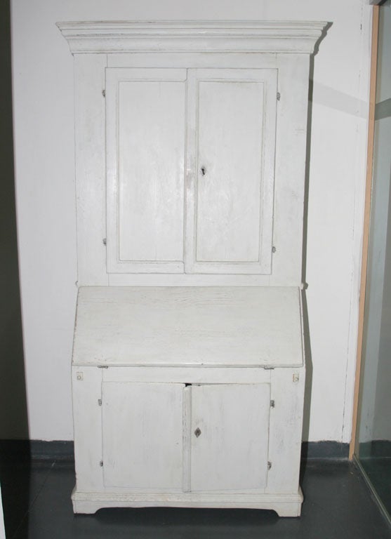 Secretary Swedish Gustavian white, 19th century, Sweden. A secretary made during the 19th century in Sweden. Painted in a distressed white. Cabinet with shelving interior.