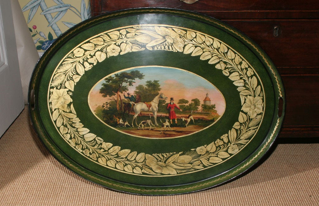 Very fine Regency oval green tole tray with a central sporting scene of the Devonshire Hunt, within a gilt foliate border and gallery, with two pierced end handles. English, circa 1820

