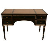 A Neoclassical Gilt and Black Painted Desk by Maison Jansen
