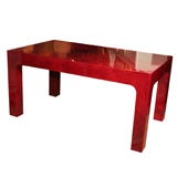 Red lacquered goatskin cocktail table in the style of Aldo Tura,