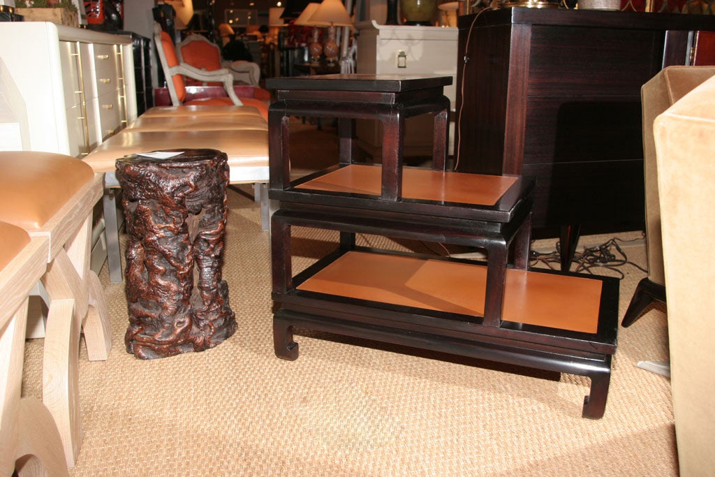 Pair of Asian inspired leather step tables