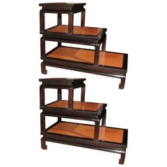 Pair of Asian inspired leather step tables