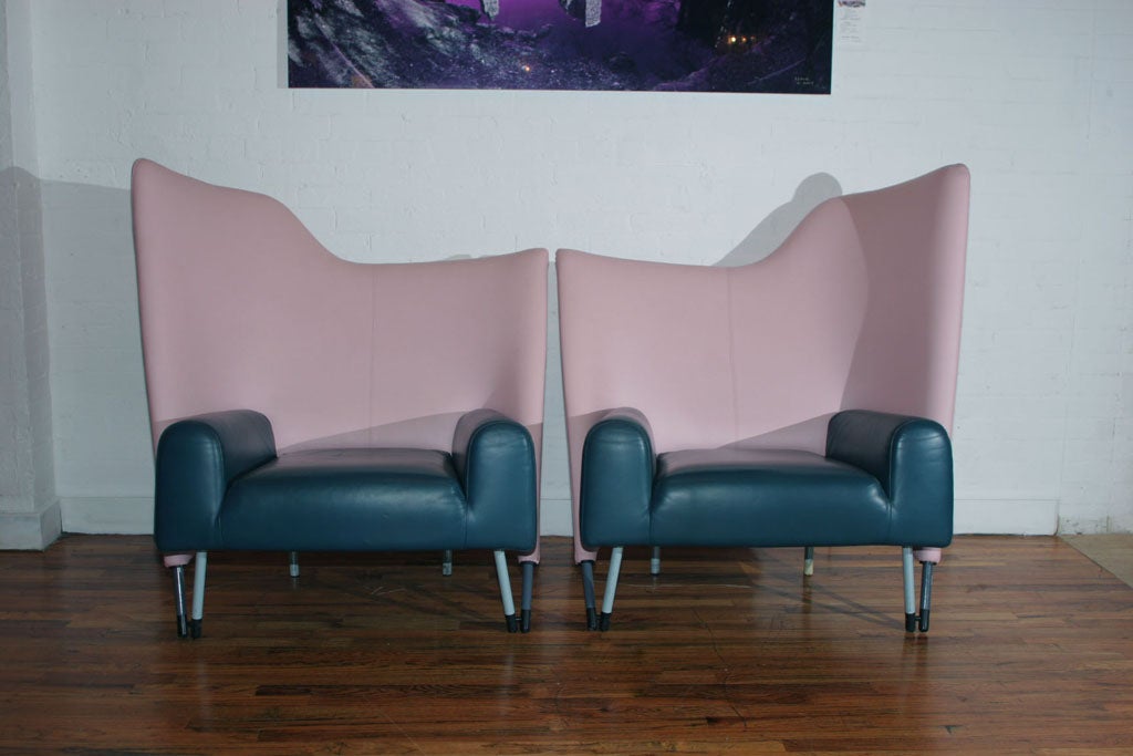Matching Pair of 2 Torso Chairs (Left and Right Side), upholstered in Leather, with Marshmallow Pink Backs and Deep Blue/Green Seats, Gray Metal supports lacquered in light blue and gray; feet in black plastic. Design produced with steel skeletal