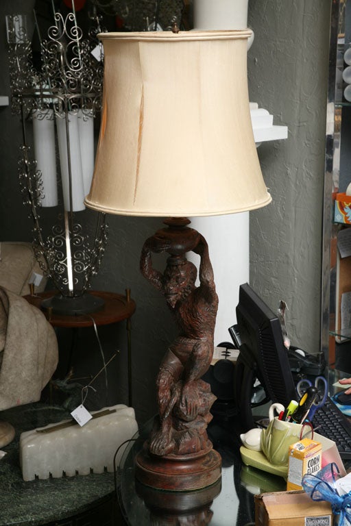 Beautifully carved Black Forest monkey lamp.