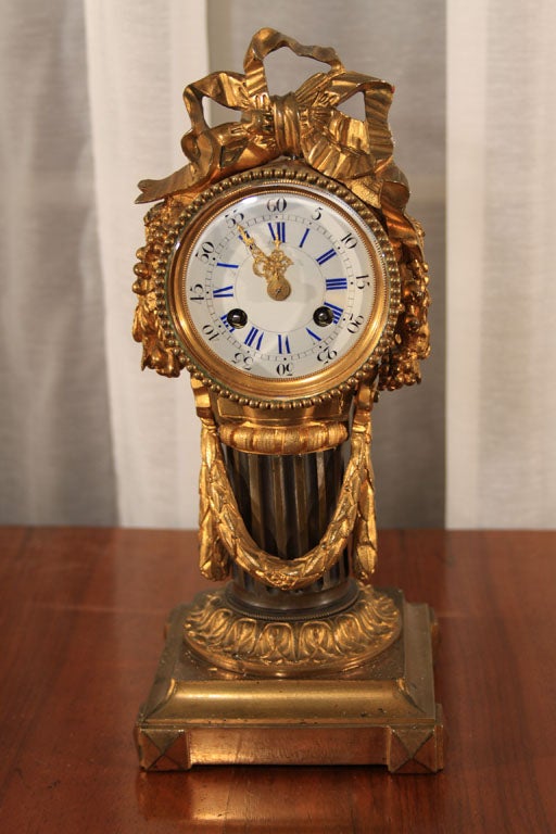 Louis XVI style pedestal clock. Clock works stamped 'Ètabt Bazelaire de Paris'.
