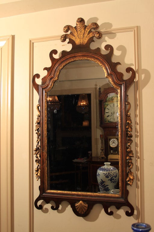 George II plume mahogany and gilt mirror.