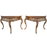 A Pair of Serpentine White Painted and Parcel Gilt Consoles