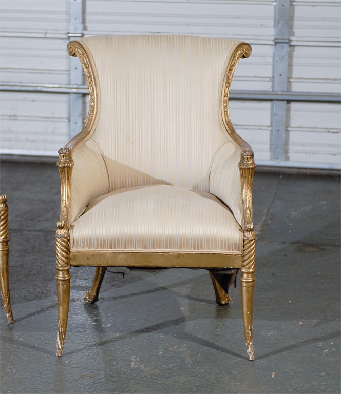 Pair of 19th century French Regency style giltwood arm chairs / bergeres