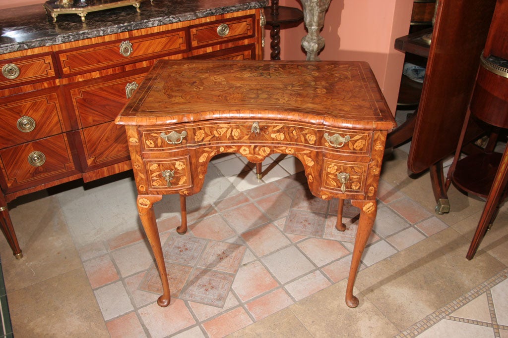 Fine Dutch Queen Ann marquetry three drawer dressing table with cabriole legs and pad feet.