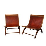 Pr. of maple and leather lounge chairs by Milo Baughman