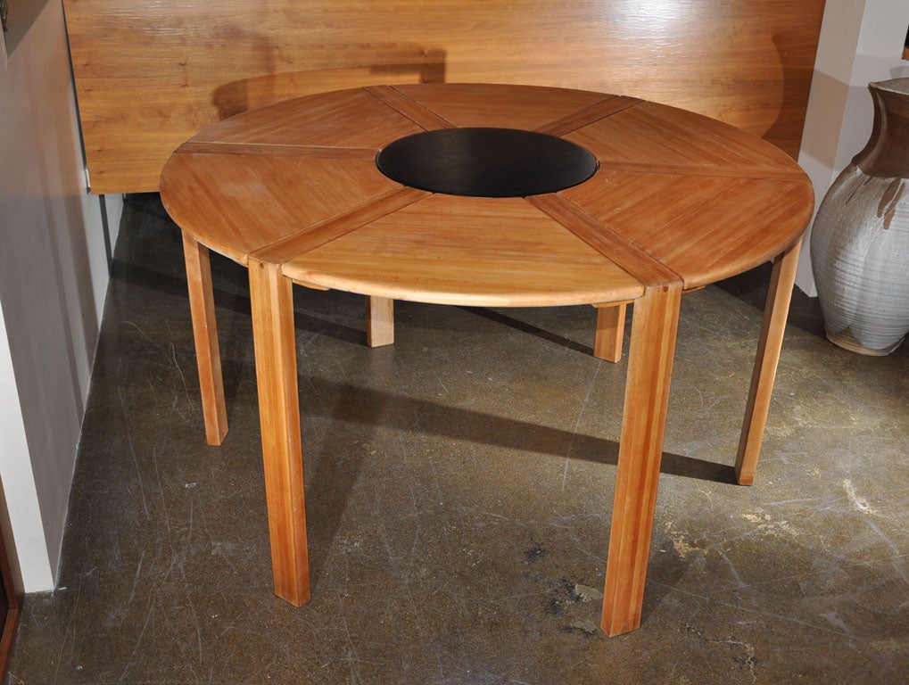 Dining table in solid beech with black lacquered center by Richard Nissen for Nissen Co. Nissen has for years been known for beautifully crafted wood table items such as serving trays, pepper mills salad bowls and accessories. In the late 70's,