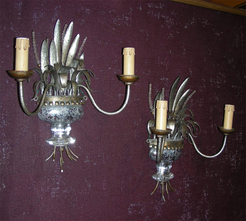 Two 1940-1950 sconces by Maison Baguès with two silver metal arms and leaves; glass base and pearls.