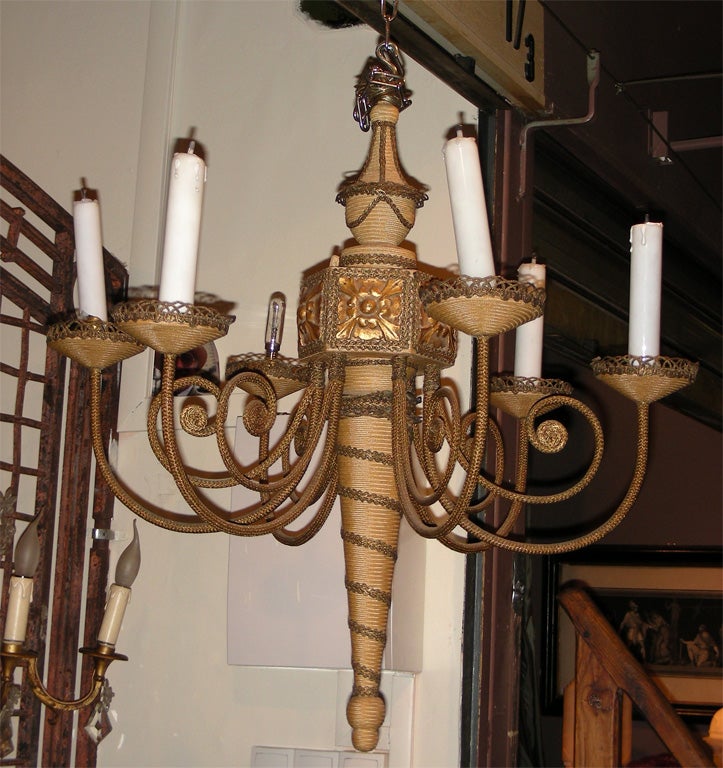 1960s chandelier in metal, clad with rope, with wood elements. Chain length 46 cm.