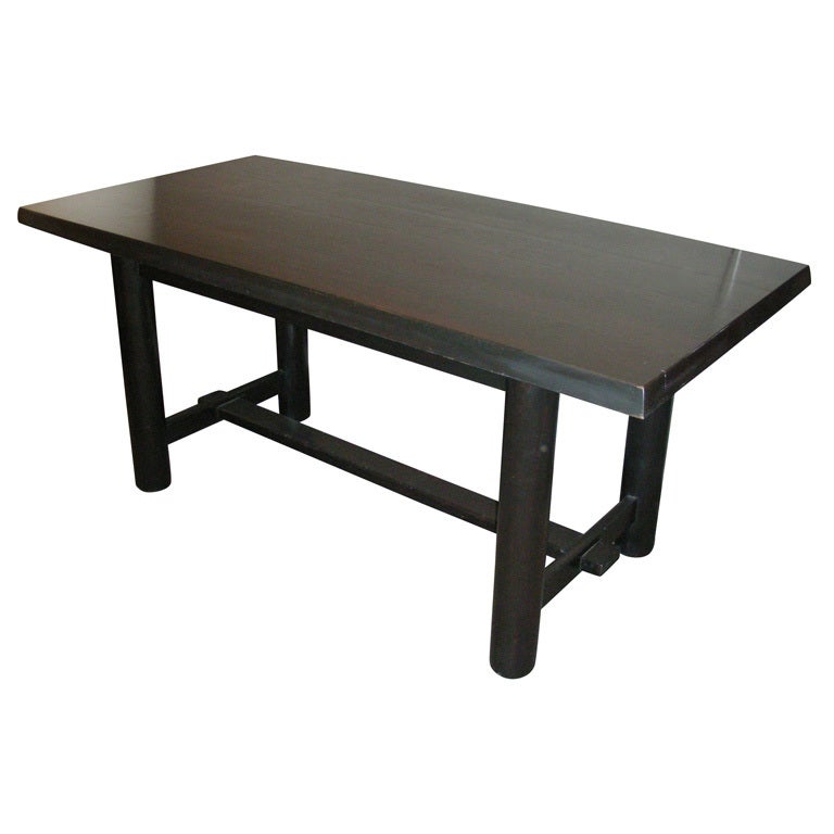 
1950s table in the style of Pierre Chapo made of black stained wood. 
Four cylindrical feet with a base structure H-shaped. The edges of the slanted.
  