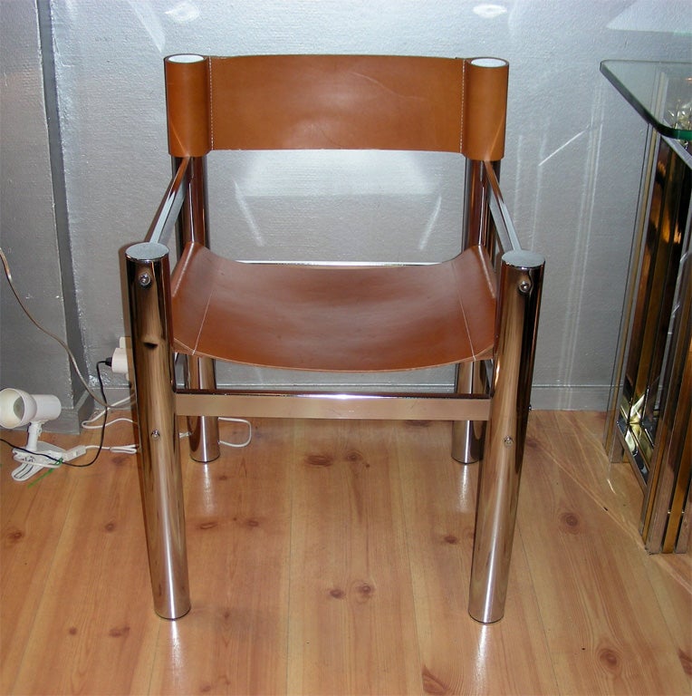 Two 1970s armchairs with structure in chromed steel and leather upholstery.