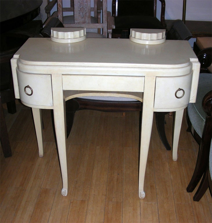 1925-1930 parchment-clad console table attributed to Paul Follot, with three drawers in the front.