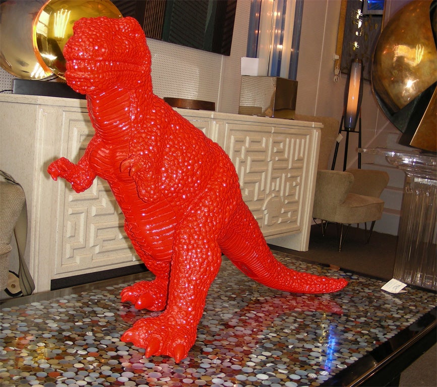 2002 red fiberglass dinosaur sculpture by Jiango Sui, number 386/1000.